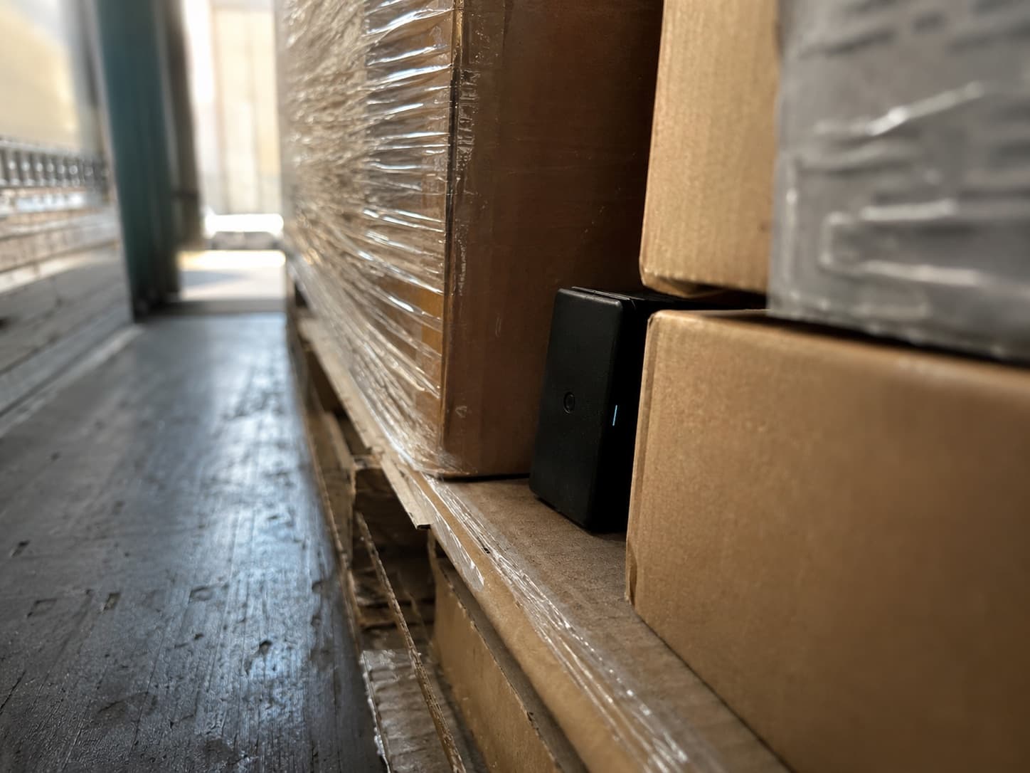 Disposable GPS tracker placed inside a freight trailer